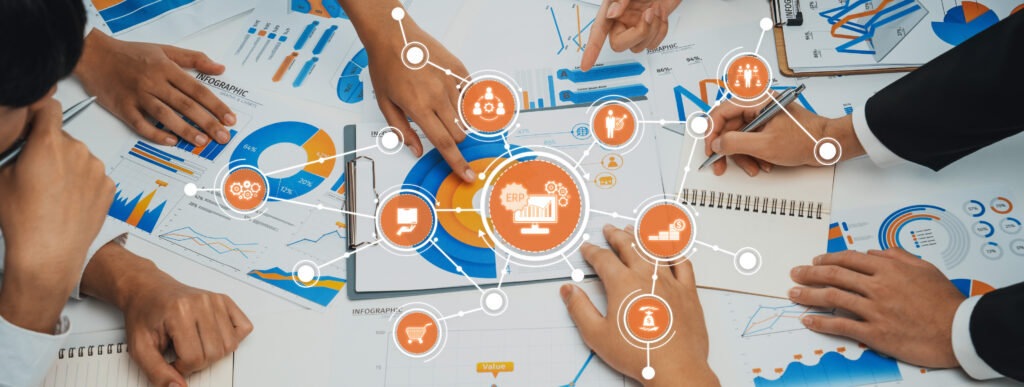 collaborative business planning and data analysis with charts, graphs, and digital tools on table for strategic decision making. amity